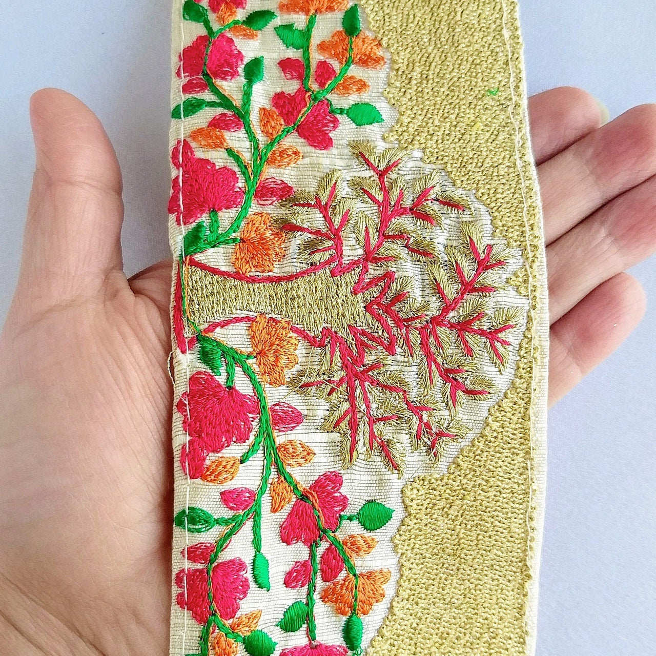 Beige Fabric Trim With Intricate Floral And Trees Embroidery In Gold, Red, Green And Orange Thread