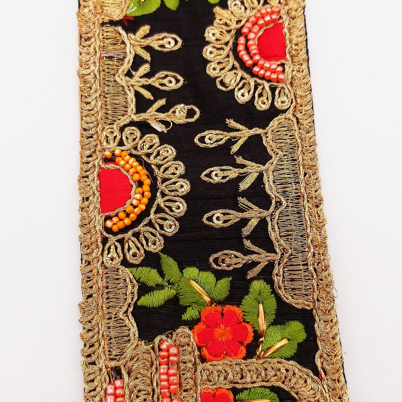 Black Art Silk Fabric Trim With Green, Orange, Red And Gold Floral Embroidery