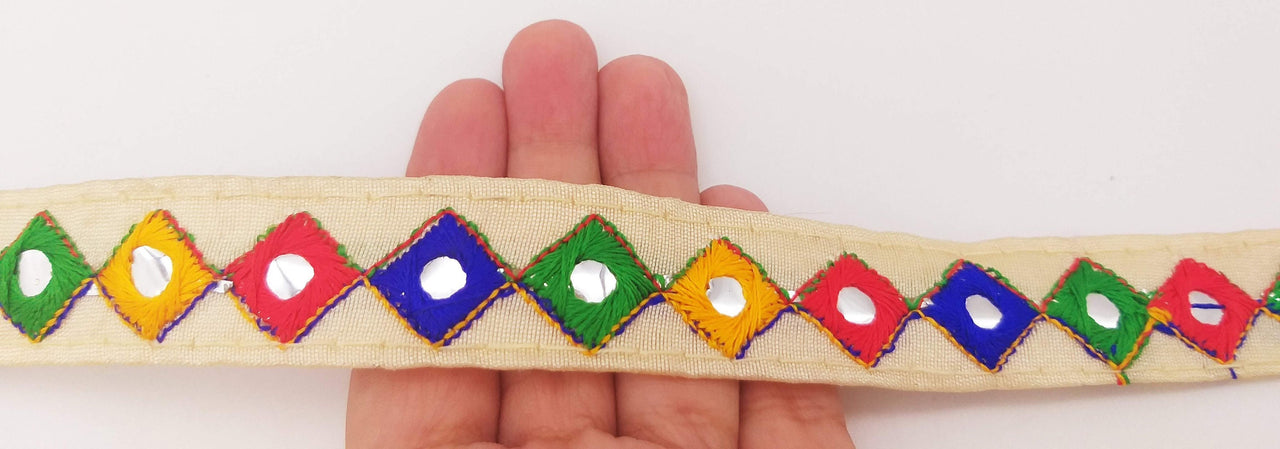 Wholesale Beige Cotton Fabric Mirrored Trim With Embroidery In Yellow, Blue, Red & Green Threads